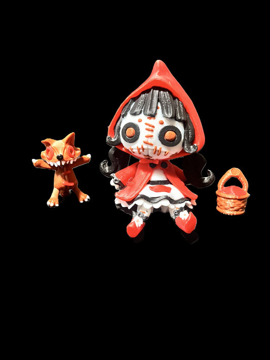 Creepy doll wearing a crimson cloak